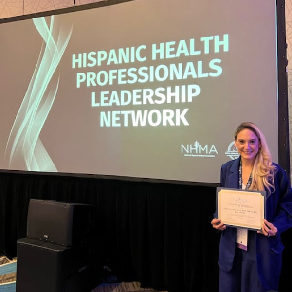 Andie Gonzales, MD, receiving the Hispanic Health Leadership Award.